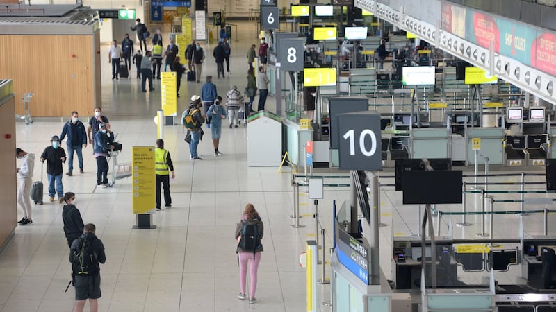 Passengers at Dublin Airport on Wednesday prepare to fly to various locations. Photograph: Dara Mac Dónaill