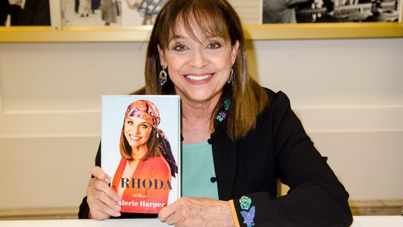 Valerie Harper holding a copy of her book I, Rhoda in Washington, DC in 2013. Photograph: Kris Connor/Getty Images