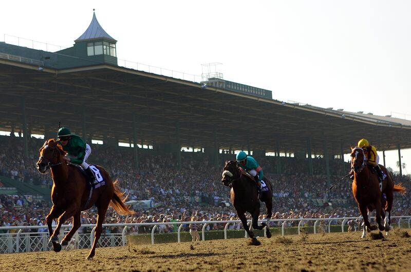 Jockey Lanfranco Dettori atop Raven's Pass crosses the finish line ahead of Mike Smith atop Tiago and Robby Albarado atop Curlin to win the Breeders' Cup Classic in Arcadia, California. Photograph: Matthew Stockman/Getty Images