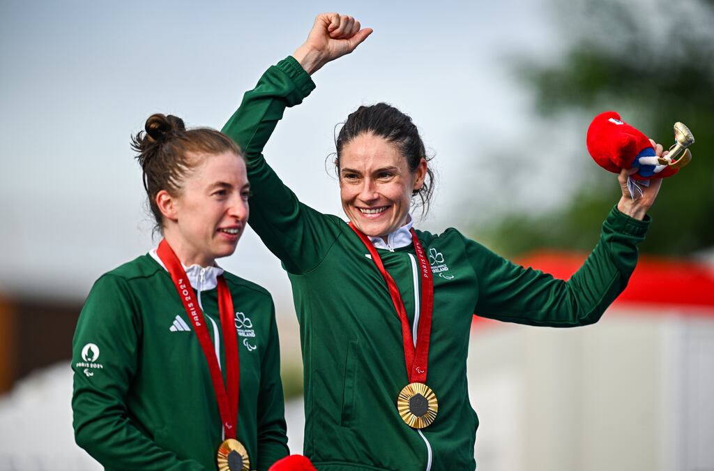 Katie-George Dunlevy, right, and pilot Linda Kelly of Ireland celebrate with their gold medals after winning the women's B individual time trial at Clichy-sous-bois in Paris, France. Photograph: Harry Murphy/Sportsfile