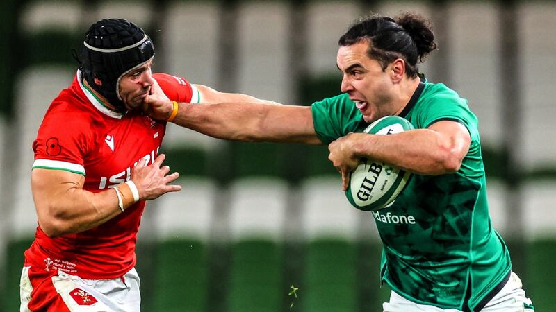 James Lowe hands off Leigh Halfpenny during his Ireland debut. Photograph: Billy Stickland/Inpho