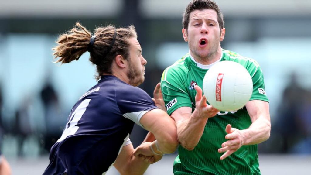 Seán Kavanagh evades Jackson Geary in Ireland’s match against a Victorian Football League selection in Melbourne. Photograph: Cathal Noonan/Inpho