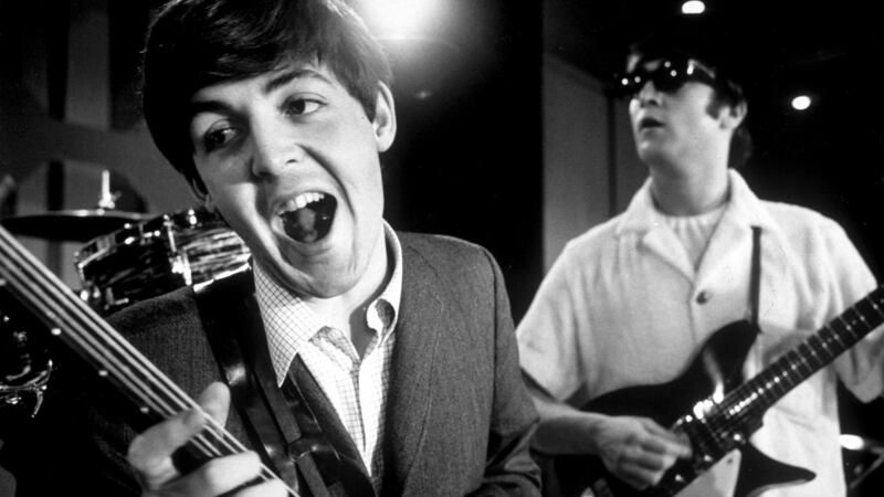 Paul McCartney and John Lennon of rock group The Beatles rehearsing on stage during American tour. Photograph: Bob Gomel//Time Life Pictures/Getty Images.