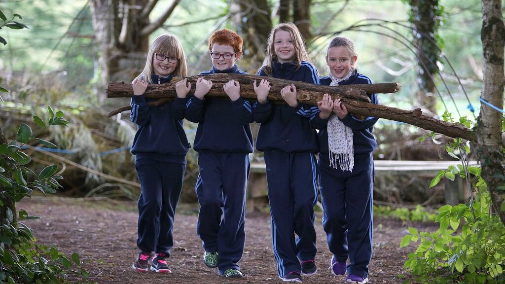 St Oliver’s national school, Killarney, Co Kerry: third-class pupils Wikoria Sloniany, Killian Sugrue, Cleo O’Connell and Jocelyn Hickey clearing the school’s woodland to have their own forest playground.  Photograph: Valerie O’Sullivan