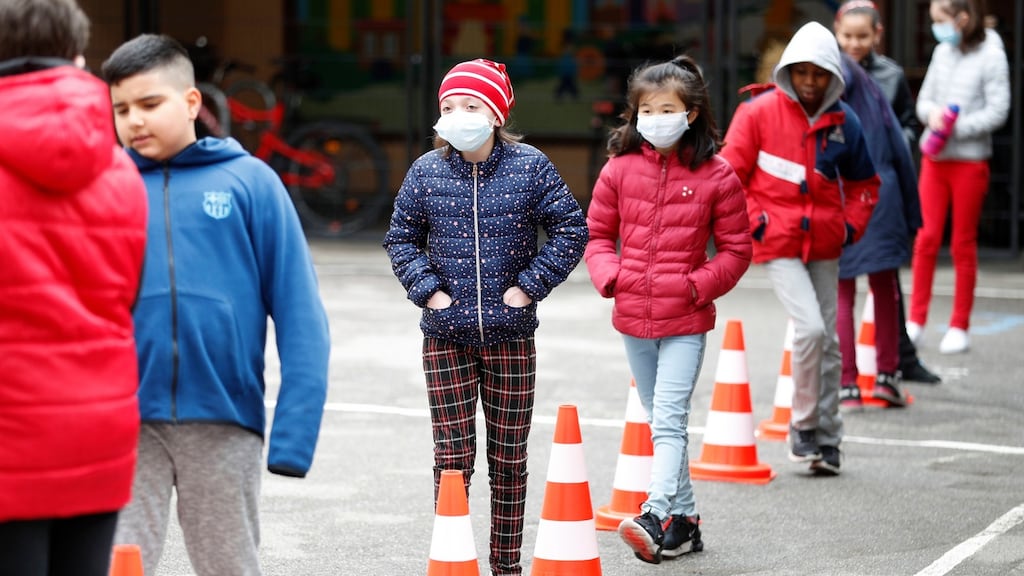 Schoolchildren wait in line to use the toilet in the schoolyard of the Sainte Aurelie primary school of Strasbourg, in France, on Thursday. Authorities say 86% of preschools and primary schools in the country are reopening this week. Photograph: Jean-Francois Badias/ AP photo