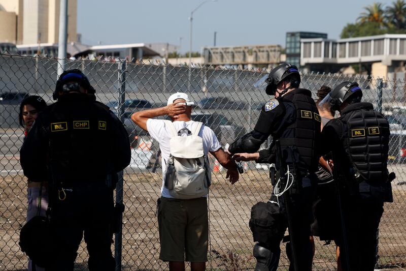 California police officers detain a protester in Los Angeles on Tuesday.Photograph: EPA