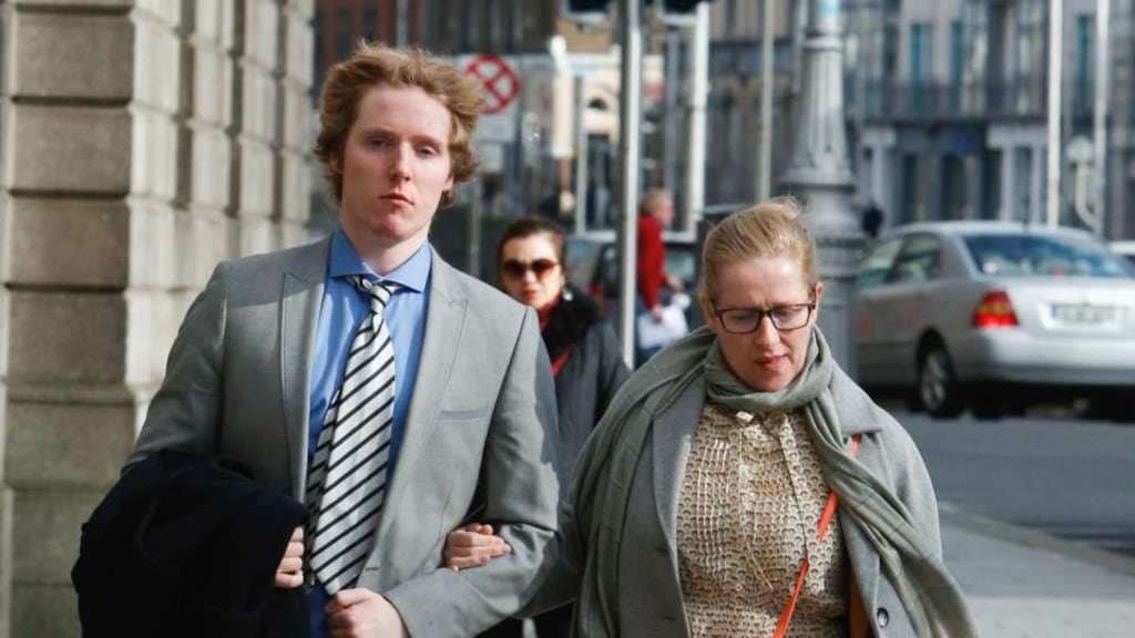 A file image of  Lucas Neville and his mother  Michelle Neville outside  the High Court in Dublin. The former St Michael’s College student was today awarded €2.75 million damages for a  brain injury suffered during a rugby match. Photograph: Collins