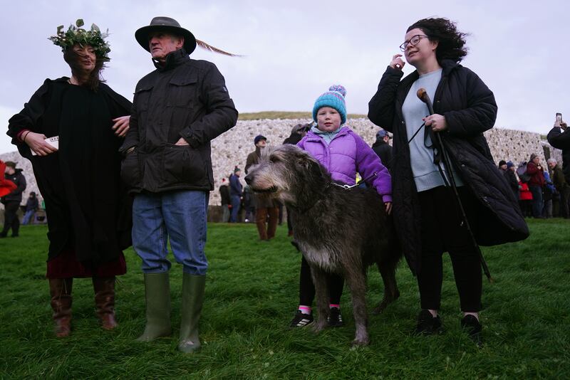 Eadaoin Heavey (right) and her eight-year-old daughter Sadhbh, who both celebrate their birthday today, pictured as people gathered for sunrise at Newgrange. Photograph: Brian Lawless/PA Wire