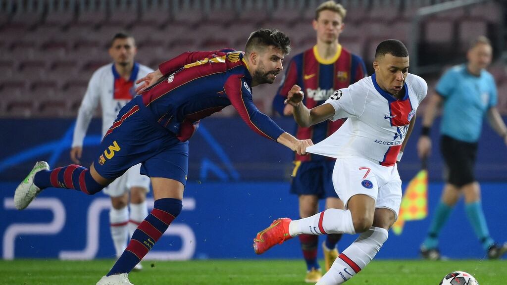 Gerard Pique can’t keep up with Kylian Mbappe. Photograph: Lluis Gene/Getty/AFP