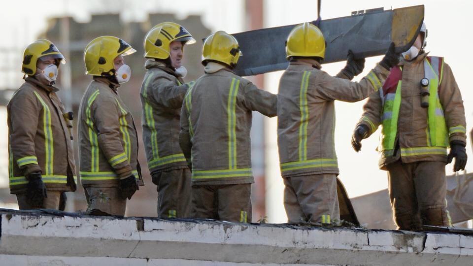 Rescue workers remove part of the wreckage from The Clutha bar in Stockwell Street where a police helicopter crashed on the banks of the River Clyde on Friday night. Photograph: Jeff J Mitchell/Getty Images