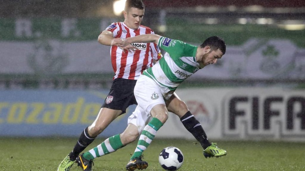 Ryan Brennan attempts to keep Derry’s Michael Duffy at bay. Photograph: Inpho/Morgan Treacy