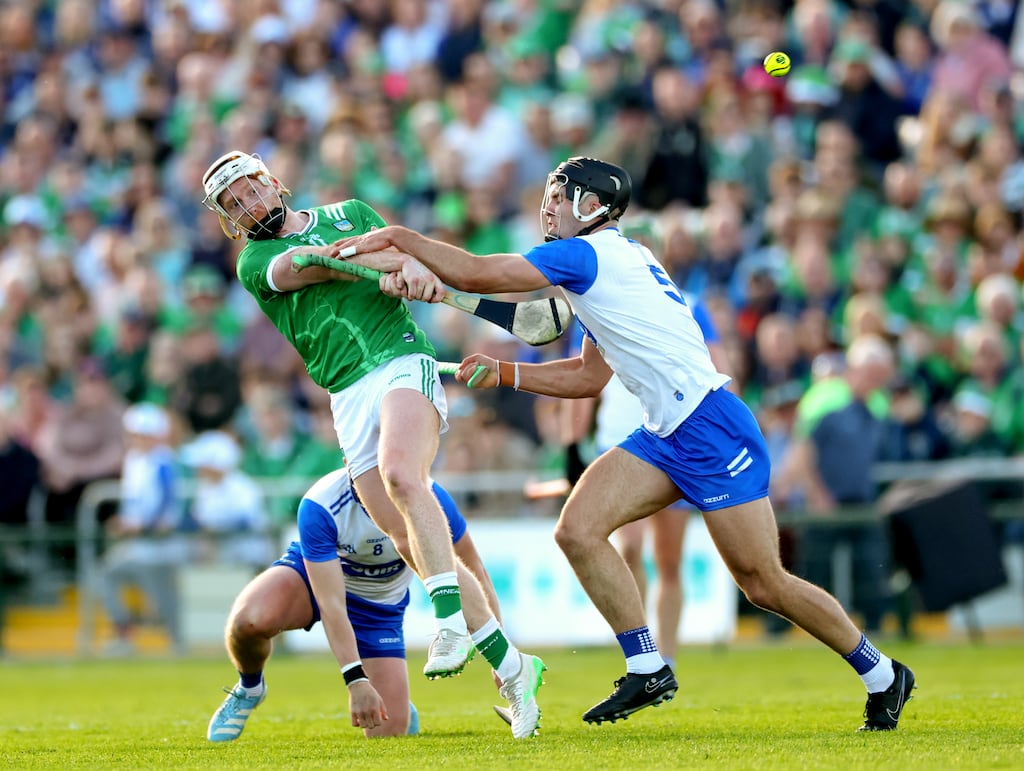 Waterford’s Darragh Lyons and Mark Fitzgerald move in to try to block Cian Lynch of Limerick during the Munster SHC game in Walsh Park. Photograph: James Crombie/Inpho