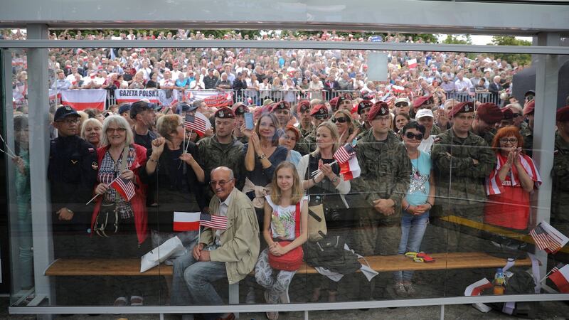 People listen to US president Donald Trump’s speech at Krasinski Square in Warsaw on Thursday. Photograph: Carlos Barria/Reuters