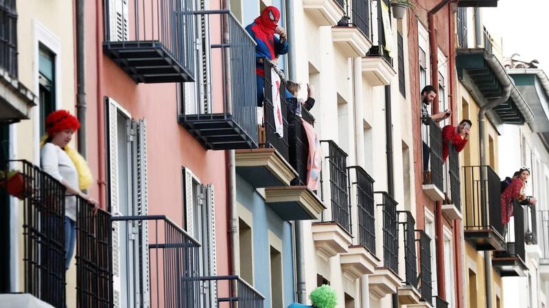 Residents in the old quarter of Pamplona, northern Spain, hold a fancy-dress event on their balconies on Thursday, as Spain goes into its fiftd day of lockdown to contain the spread of the Covid-19 pandemic. Photograph: Jesus Diges/EPA