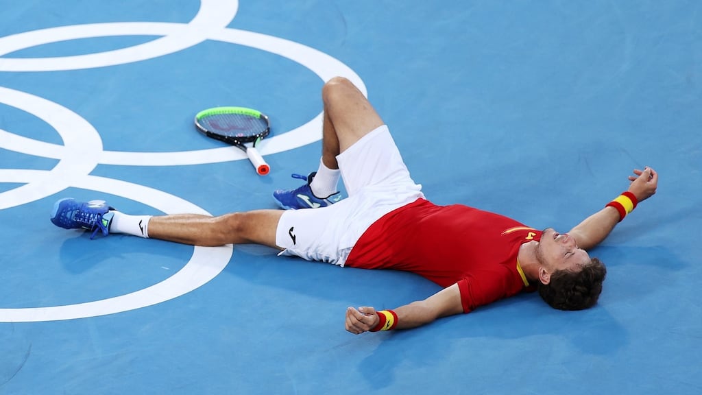 Pablo Carreno Busta celebrates his victory over Novak Djokovic. Photograph: Clive Brunskill/Getty