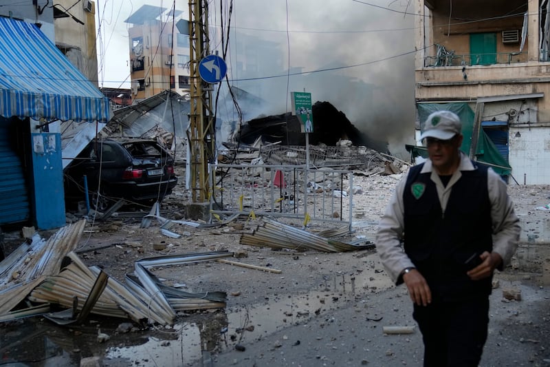 A man leaves a street after seeing the building where he was living in Dahiyeh, Beirut, Lebanon destroyed by an Israeli air strike. Photograph: Hussein Malla/AP