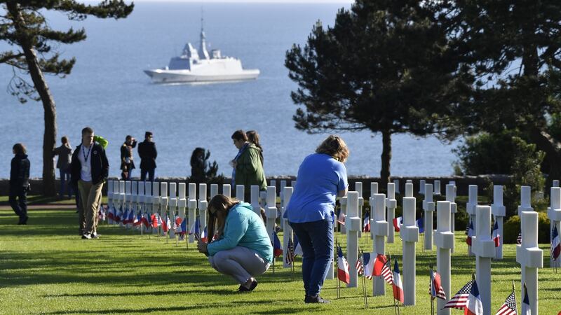 Attendees inspect headstones at the Normandy American Cemetery and Memorial in Colleville-sur-Mer, France, on Thursday. Photograph: Geert Vanden Wijngaert/Bloomberg
