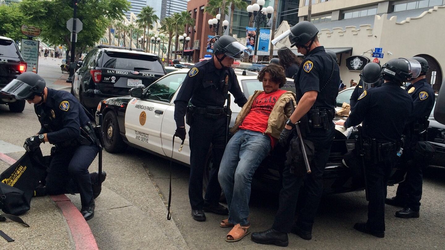 A man is taken into custody by police after a rally for Republican presidential candidate Donald Trump. Photograph: AP
