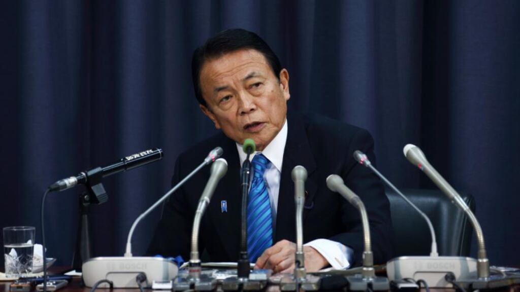 Taro Aso, Japan’s deputy prime minister and finance minister, speaks during a news conference announcing the governments planned military spending. Photograph: Tomohiro Ohsumi/Bloomberg