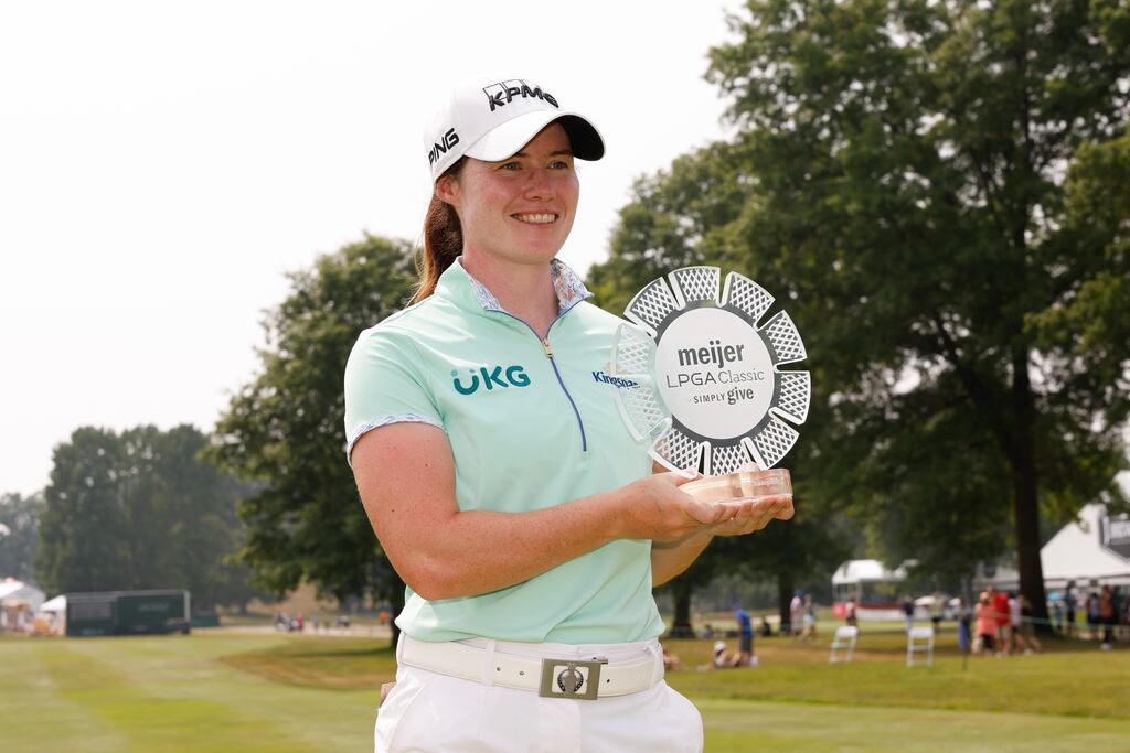Leona Maguire poses for a photo with the trophy after winning the Meijer LPGA Classic for Simply Give at Blythefield Country Club on Sunday. Photograph: David Berding/Getty Images