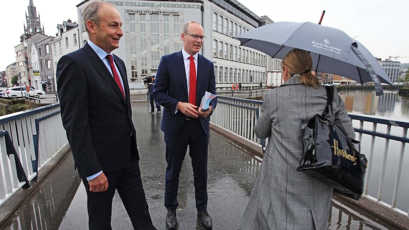 Fianna Fáil leader Micheál Martin and Tánaiste Simon Coveney canvassing in Cork city on Monday morning for a Yes vote in the upcoming referendum. Photograph: Diane Cusack