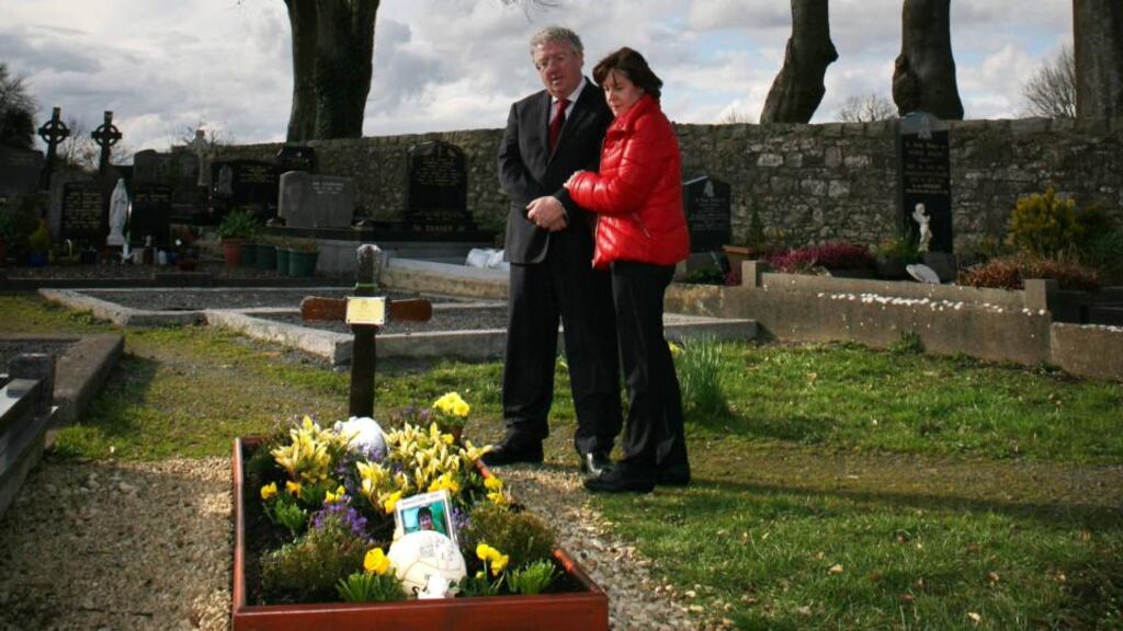 Andrew Dolan’s parents, Joe and Rosie, at his graveside in Ardcarne Cemetery , Co Roscommon. Photograph: Brian Farrell