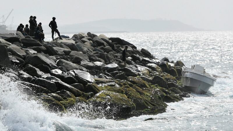 Security forces guard the shore area and a boat in which authorities claim a group of armed men landed in the port city of La Guaira, Venezuela, on Sunday. Photograph: Matias Delacroix/AP