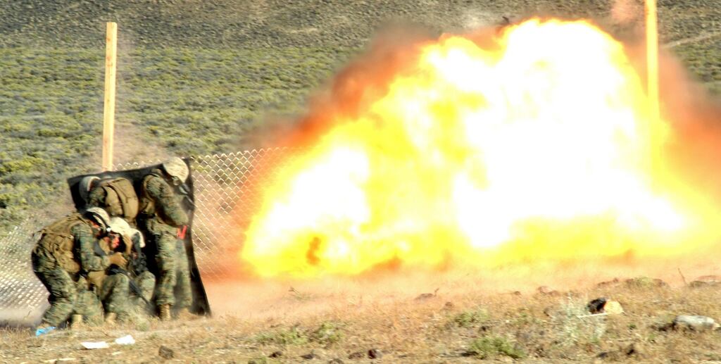 A US Marine Corps handout photo from 2010  shows marines blowing a hole in a fence during training at the Hawthorne Army Depot in Nevada. Photograph: Reuters