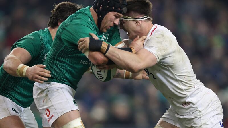 Sean O’Brien is tackled by Tom Curry during the Six Nations loss to England. Photo: Billy Stickland/Inpho