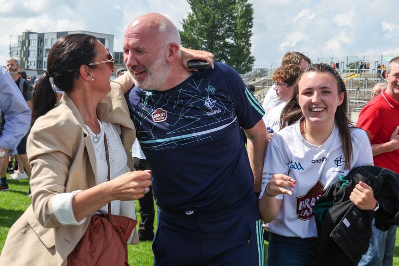 Glenn Ryan celbrates with his wife Josephine and daughter Aimee after the final whistle. Photograph: Paul Dargan/Inpho