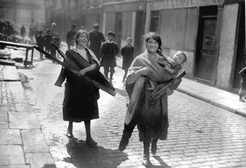 Children carry wood from Sackville Street, Dublin on May 1st, 1916 after the after the Easter Rising. Photograph: PA