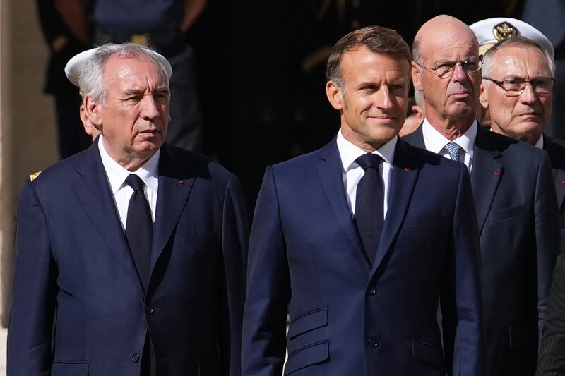 French prime minister François Bayrou (left) and president Emmanuel Macron attend a farewell-to-arms ceremony earlier this month. Photograph: Christophe Ena/Pool/AFP/Getty