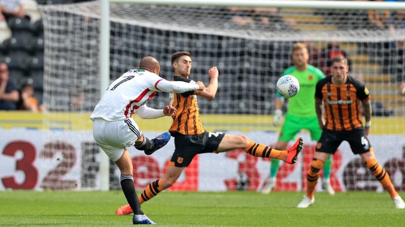 Sheffield United’s David McGoldrick scores his side’s second goal in their win over Hull. Photograph: Mike Egerton/PA