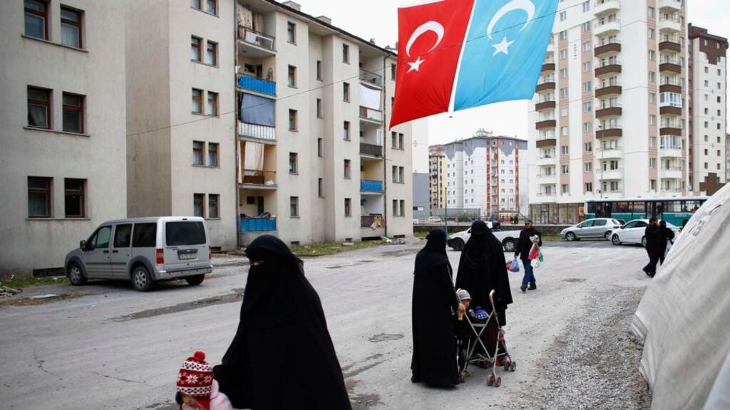 Uighur refugee women in a gated complex in the central city of Kayseri, Turkey. Photograph: Umit Bektas/Reuters