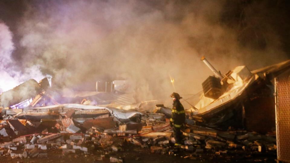 A firefighter among smoking rubble after demonstrators burned buildings in protest against the grand jury decision not to indict a police officer for shooting dead Michael Brown, in Ferguson, Missouri. Photograph: Larry W Smith/EPA