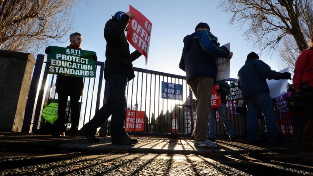 Madeleine Ní Ghallchobhair, a teacher of Irish and English who graduated in 2012, feels there has been a deliberate strategy at Government level to divide the different teacher unions. Above, TUI and ASTI members on strike in 2014. Photograph: Cyril Byrne
