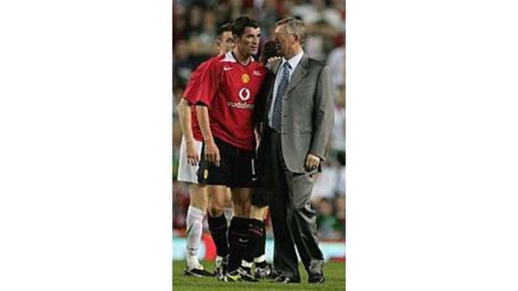 Roy Keane shares a quiet word with Alex Ferguson after his testimonial at Old Trafford