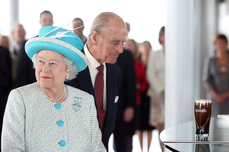 Guinness Storehouse: Prince Philip eyes a pint of plain in Dublin in 2011. Photograph: Pool/Getty
