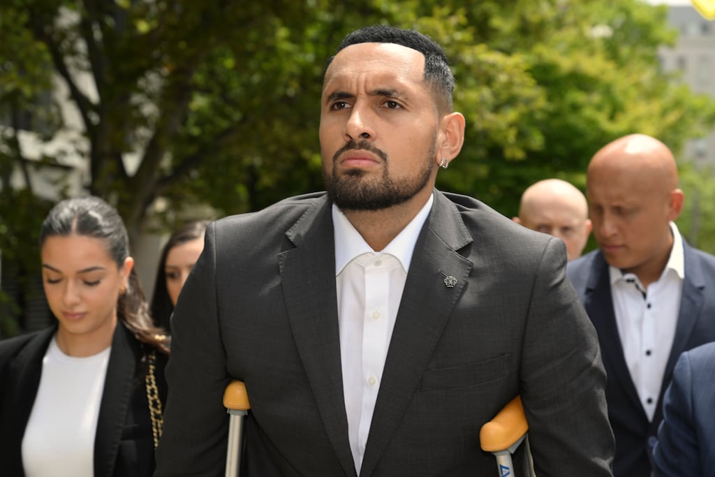 Australian tennis player Nick Kyrgios arrives on crutches at court in Canberra. Photograph: Mick Tsikas/AAP Image via AP