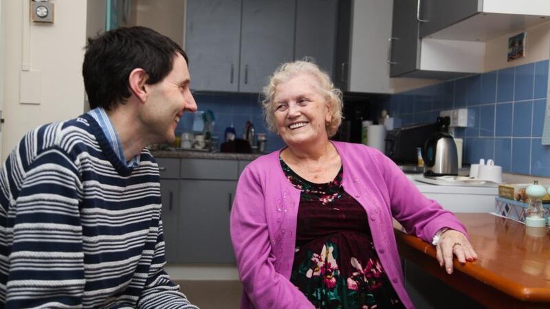 Paul Raymond, manager of the Irish Chaplaincy Service seniors project, talks to client Veronica Finney (79) in her flat in west London. She is originally from Armagh. Photograph: Joanne O’Brien
