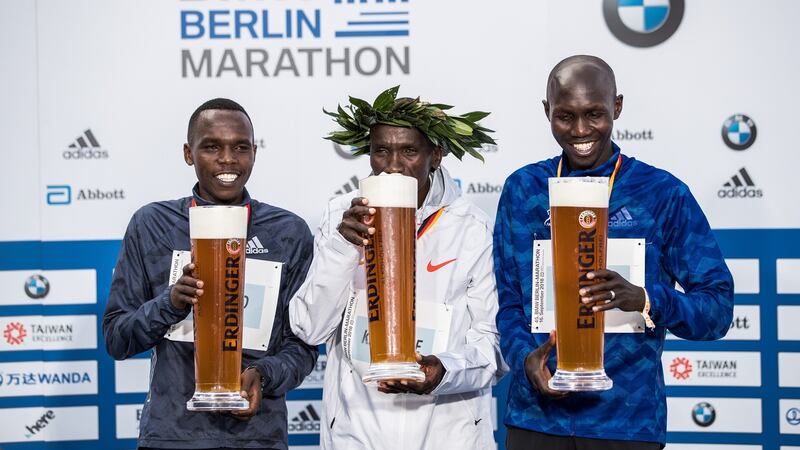 Kipchoge (C) poses with Amos Kipruto and Wilson Kipsang (R) all of Kenya during the ceremony. Photo: Maja Hitij/Bongarts/Getty Images