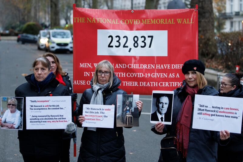 Members of 'Covid-19 Bereaved Families For Justice' group protest outside the UK Covid-19 inquiry, after the former health secretary Matt Hancock arrived to give evidence in London. Photograph: Tolga Akmen/Shutterstock/EPA-EFE