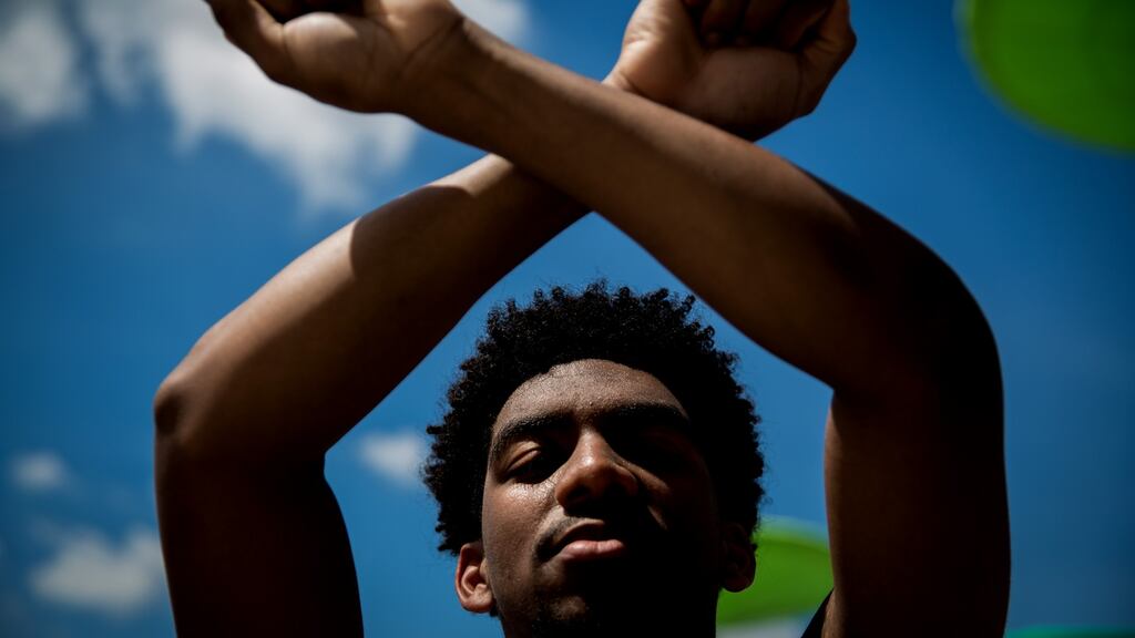 Austin Trosclair makes an X sign at a memorial and viewing for rapper XXXTentacion at the BB&T Center in Sunrise, Florida, on June 27th, 2018. Photograph: Scott McIntyre/The New York Times.