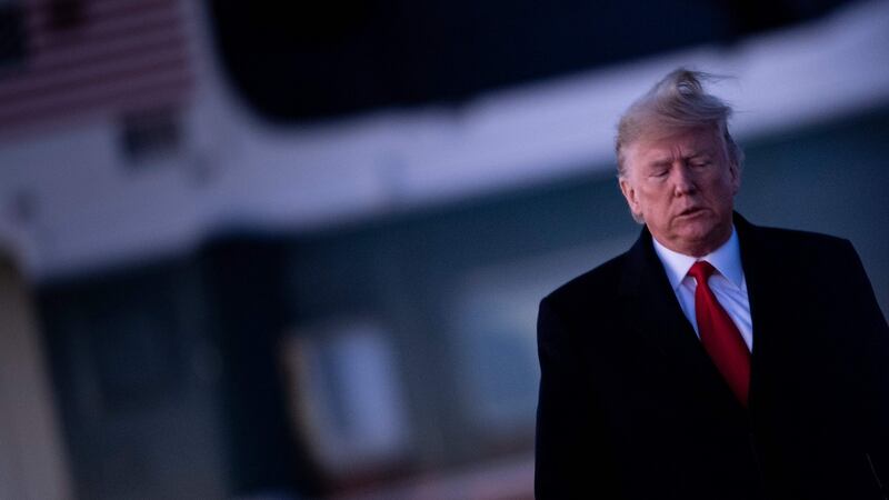 US president Donald Trump at Andrews Air Force Base in Maryland on Wednesday as the US House of Representatives debated his impeachment in Washington. Photograph: Brendan Smialowski/AFP via Getty Images