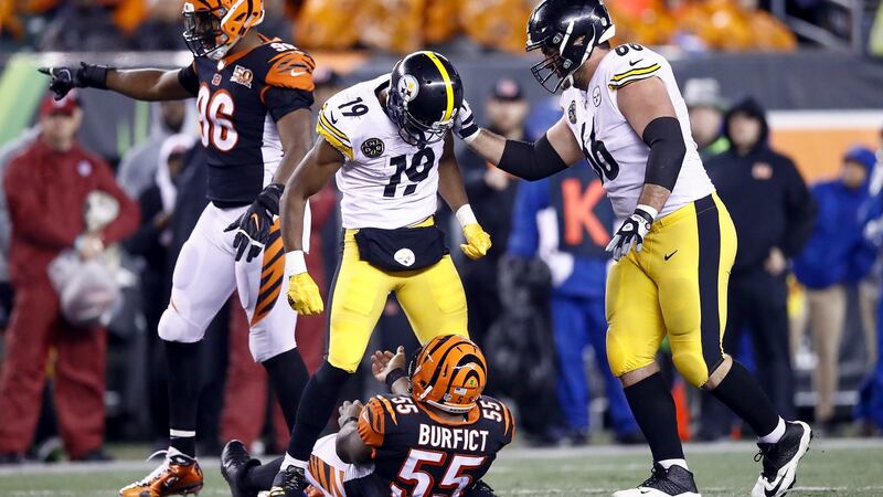 JuJu Smith-Schuster of the Pittsburgh Steelers stands over Vontaze Burfict of the Cincinnati Bengals. Photo: Andy Lyons/Getty Images