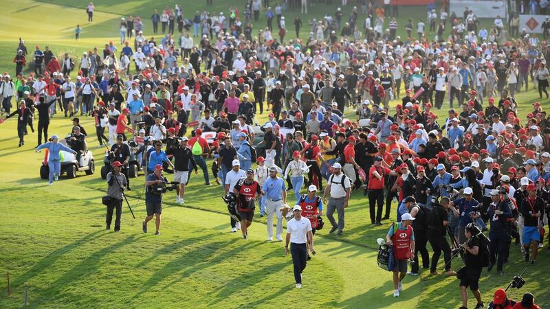 Rory McIlroy walks up the 18th in Shanghai. Photograph: Ross Kinnaird/Getty