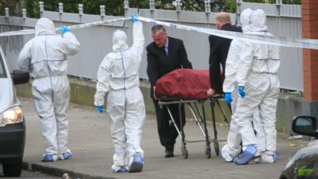 The body of Kieran Farrelly is removed from the scene at Killarney Court flats off Buckingham Street, Dublin. Photograph: Gareth Chaney/Collins