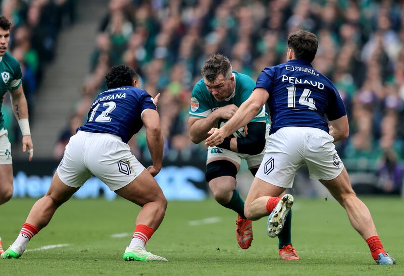 Ireland's Peter O'Mahony comes up against France's Yoram Moefana and France's Damian Penaud. Photograph: Dan Sheridan/Inpho