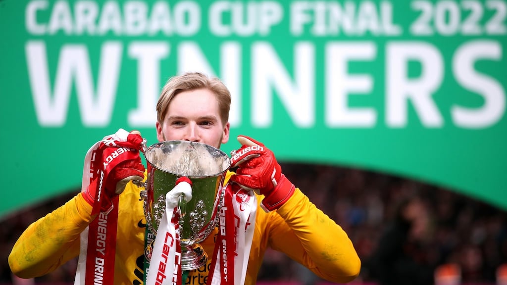 Liverpool goalkeeper Caoimhin Kelleher celebrates with the League Cup trophy at Wembley Stadium. Photograph: Nick Potts/PA