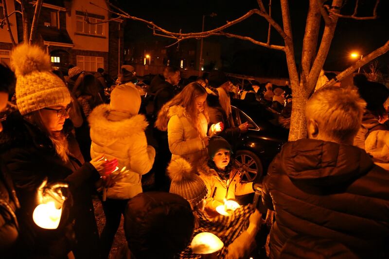 A vigil was held for Conor, Darragh and Carla outside the house where their remains were discovered at Parsons Court in Newcastle, Co Dublin on Friday night. Photograph: Stephen Colllins